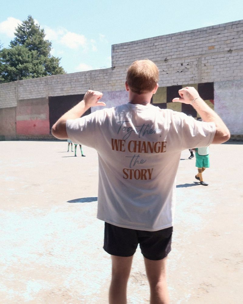 Hayden in a We Change Story shirt